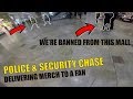 Police  security chase through mall delivering merch to a fan
