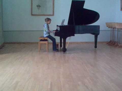 Grace-Christine playing the piano