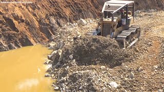 Bulldozer Pushing Dirt In New Project To Complete A Deep pond! Trucks Unloading, Excavators Digging!