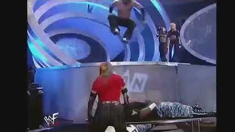 Matt Hardy leg drops Devon Dudley off stage through table