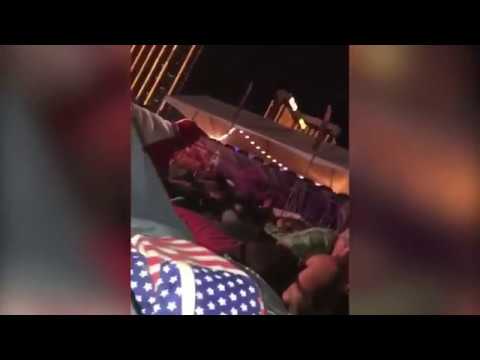 Las Vegas concert goers hit the ground for cover as sounds of gunfire erupt (raw video)