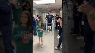 Quadruple amputee walks out of hospital to applause from caregivers | Ohio State Medical Center
