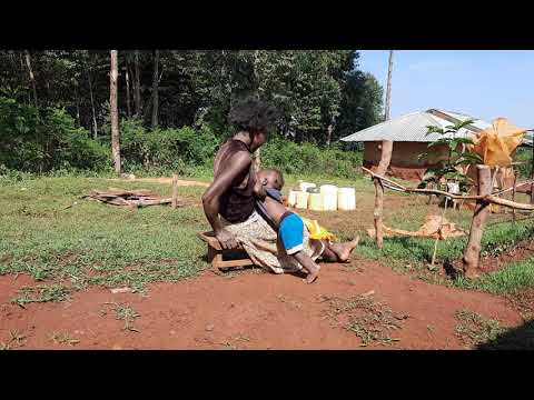 Funny Breastfeeding Toddler/ African village life