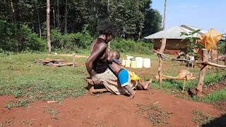 Funny Breastfeeding Toddler/ African village life