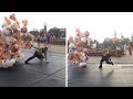 Disney worker struggles with balloons in wind