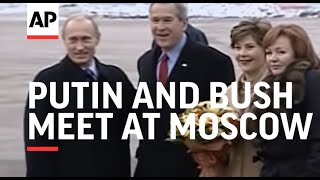 Putin and Bush meet at Moscow airport as US president heads to Asia