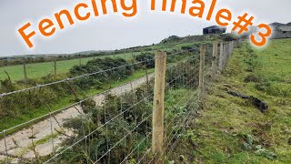 Farm fencing , tensioning wires and tying off on posts