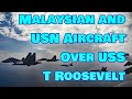 Malaysian Sukhoi SU-30s and U.S. Navy F/A-18s over the USS Theodore Roosevelt in new video