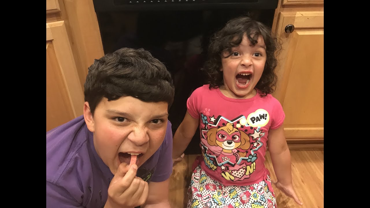 Kids feel the heat of Hotheads Extreme Heat Worms Candy! Family Reacts!