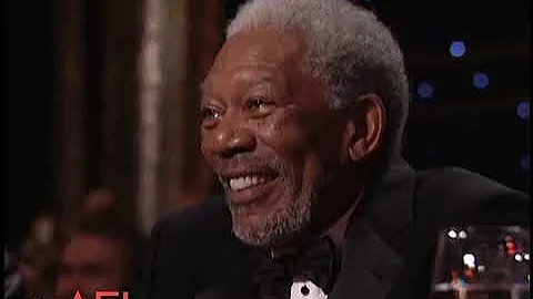 Betty White surprises Morgan Freeman at AFI awards.