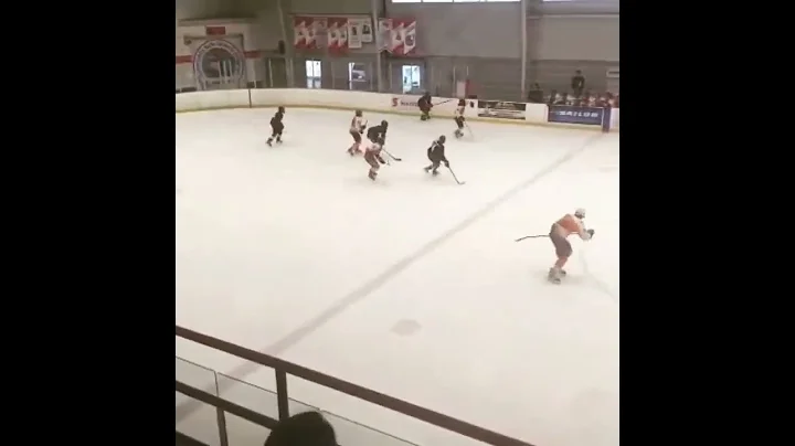 Blake Clayton #52 in blue standing up the hit