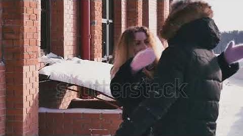 Girl smiles and hugs guy slow motion