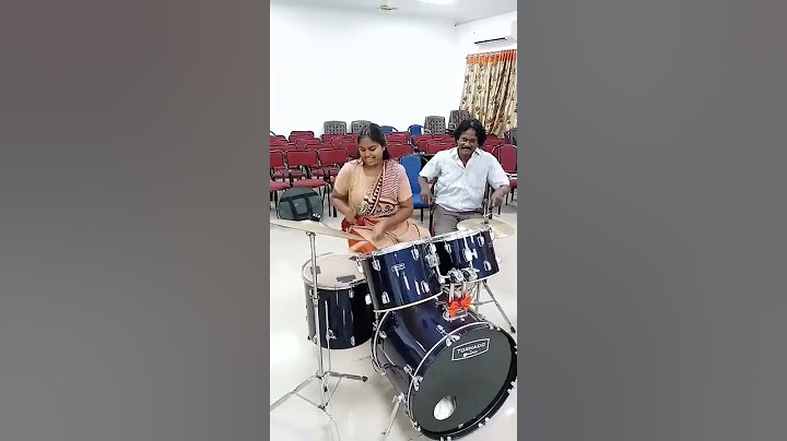 Girl playing drums rolls