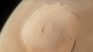 Orbiting over Olympus Mons, highest mountain in the Solar System