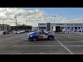 Subaru rally car does a handbrake turn at a dealership