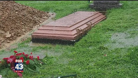 Flooded cemetery raises burial vault and more questions