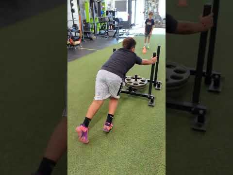 Mason and Max, two of our youth athletes, developing some lower body power with these sled pushes