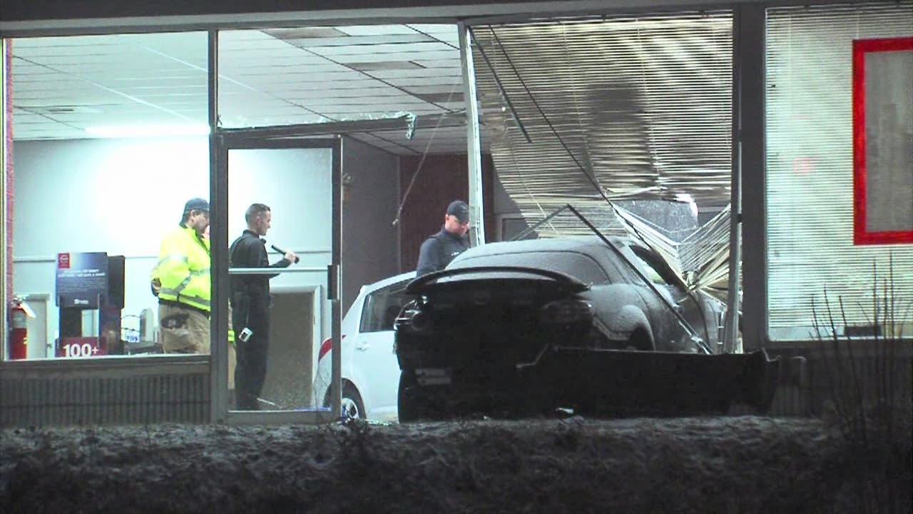 430am Car crashes through dealership YouTube
