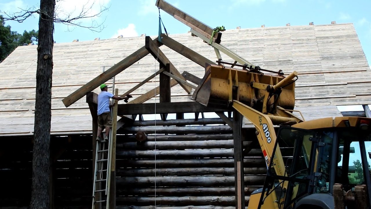 Getting the 4x10 rafters bolted together and up on the ridge beam - YouTube