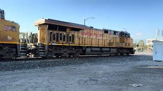 A Union Pacific (UP) container train (or intermodal train) leaving LA