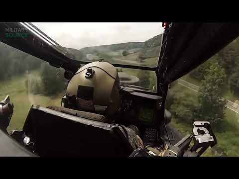 AH-64 "Apache" cockpit view, low below the peaks of trees flight