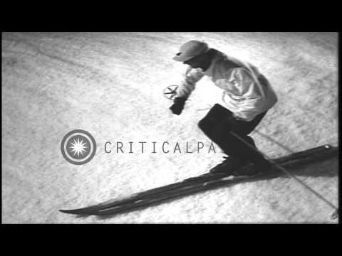 Men sliding down slope and demonstrating the traversing position in the United St...HD Stock Footage