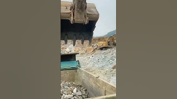 Heavy-duty hydraulic hammer drilling deep into compacted soil for structural foundation setup.