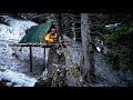 Building a complete winter shelter on a old tree stump in harsh conditions