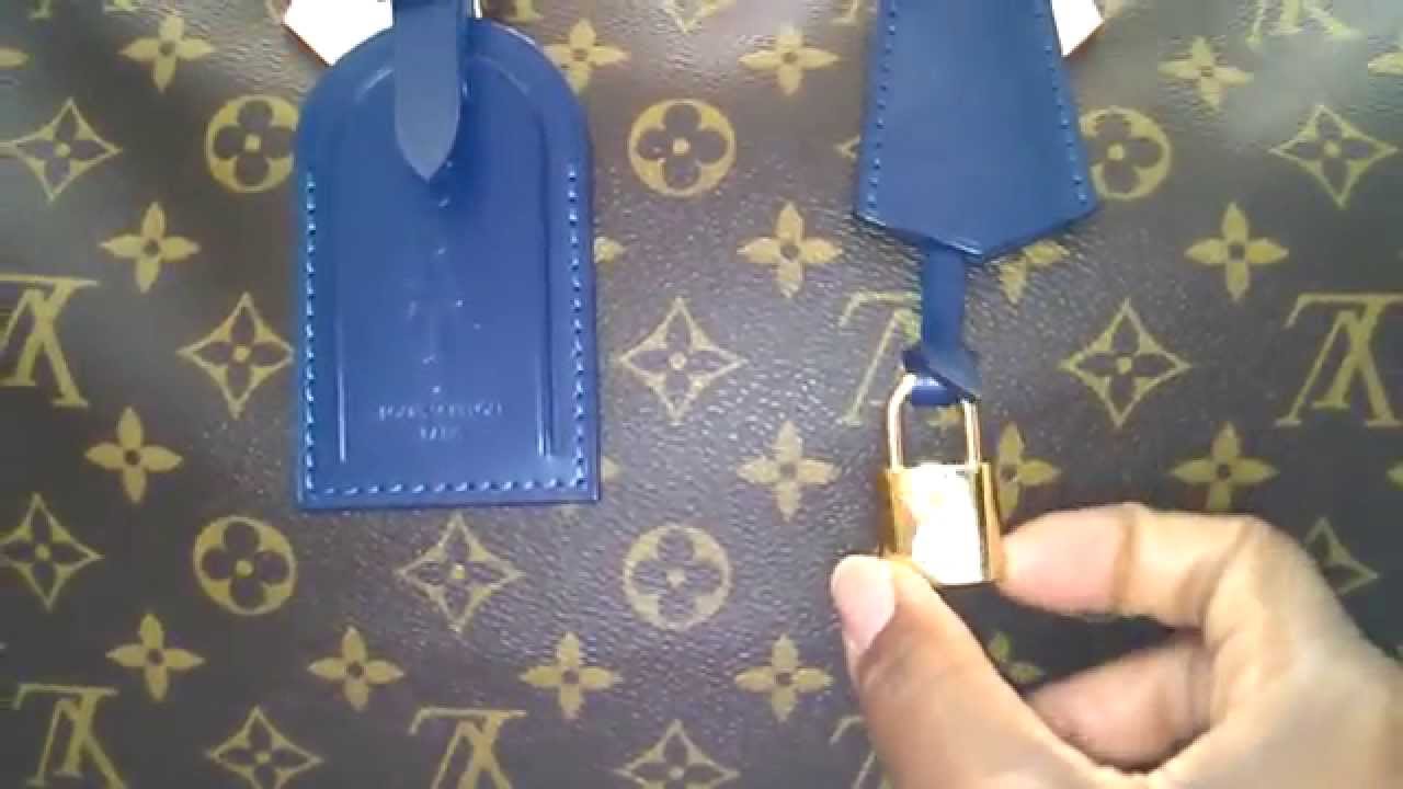 louis vuitton handbag with lock and key