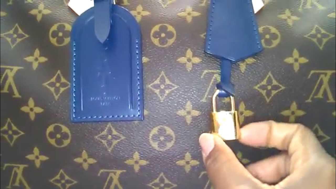 louis vuitton purse with lock and key