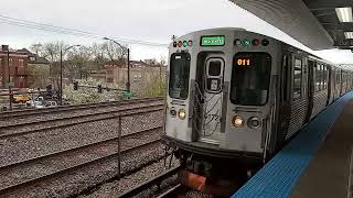 Metra train passing Central Green line CTA station from downtown Chicago 4/18/23
