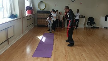 Kung Fu Training for Children Practicing Forward Rolls Praying Mantis Sifu Bryan Barnes