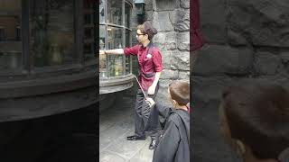 Alex doing an interactive spell with his wand in harry potter land at universal studios Hollywood ma