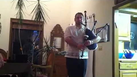 Charles on the bag pipes Loch Lomand