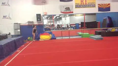 Round off back-handspring-double twist. (Izi)
