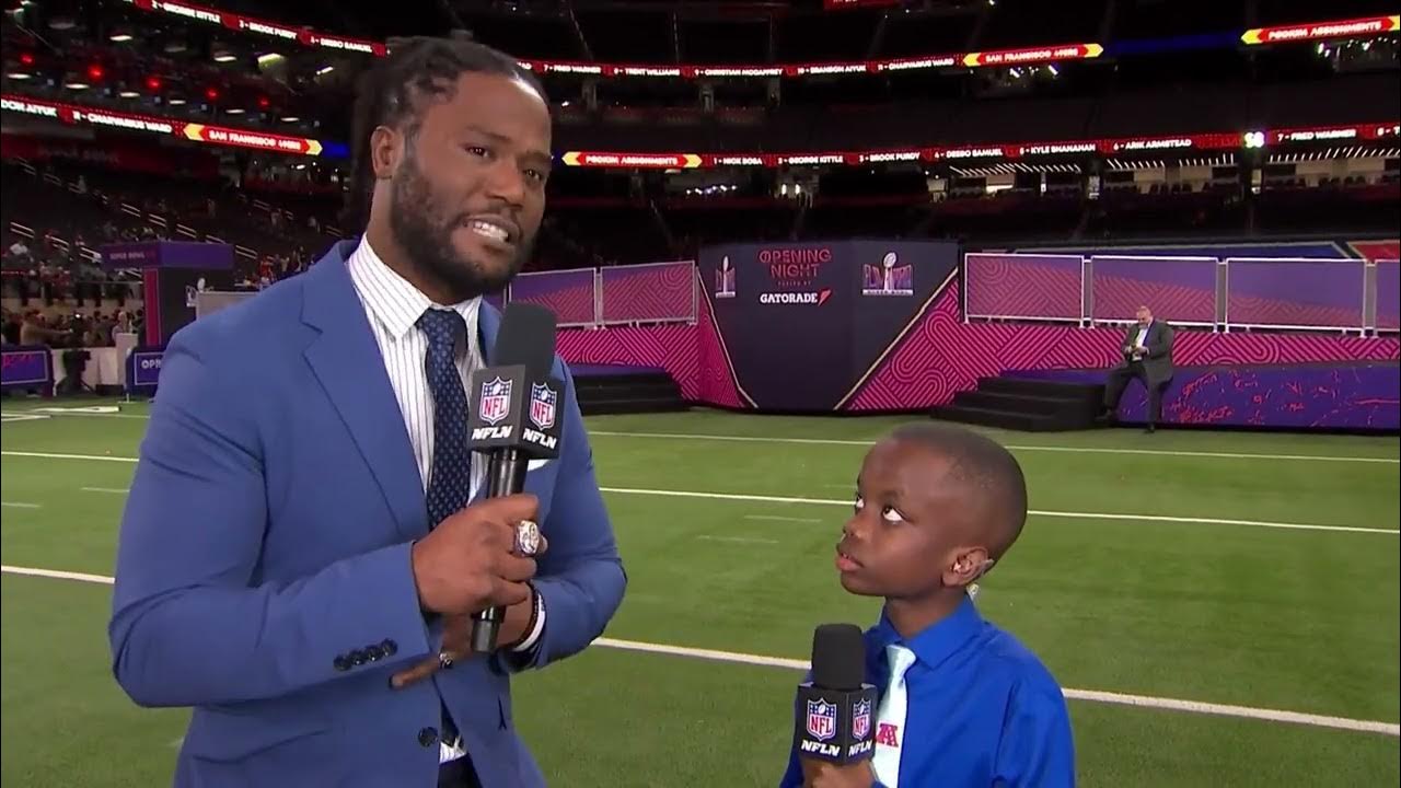 11 year old reporter Jeremiah Fennell and NFL Network's Michael