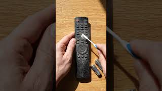 How to clean dust from TV remote buttons?