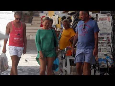 Kate Moss flashes her legs in emerald green summer dress in Greece