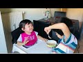 Adorable baby cant stop laughing while eating