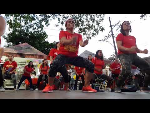 Zumbaranggay in red 1 dancing in the street