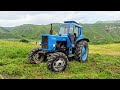 Трактор МТЗ 82.Синий Трактор Мтз 82 с ротором в поле . Blue tractor MTZ 82 with a rotor in the field