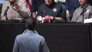 Beto O'Rourke approaches Gov. Greg Abbott, interrupting press conference