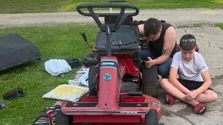 Fixing old mowers and making memories at the same time
