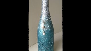 Botella decorada con papel de aluminio y relieve