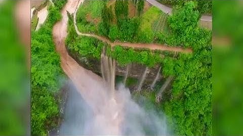 Rainstorm-triggered flood forms spectacular waterfalls in southwest China