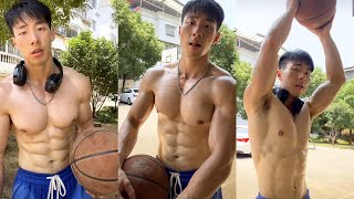 asian muscular teen playing basketball.