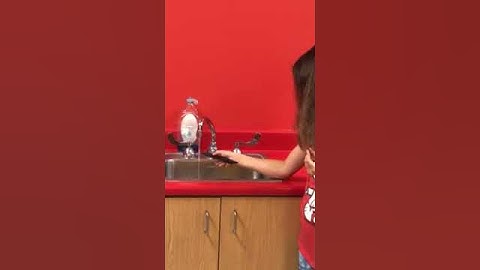 Using a charged comb to bend water