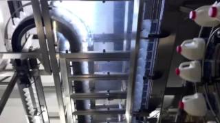 Bottle packaging - high-level bottle fillers with bottle lowerator.