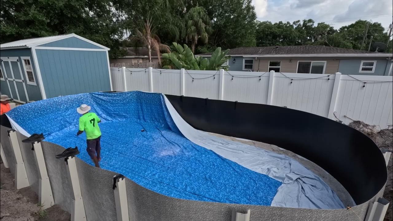 Pool factory 15x30 oval above the ground semi in the ground pool