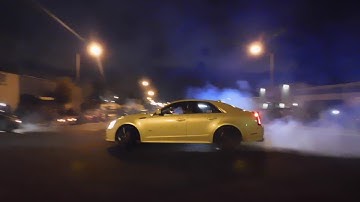 Guy jumps on CTS-V, breaks his window while doing donuts